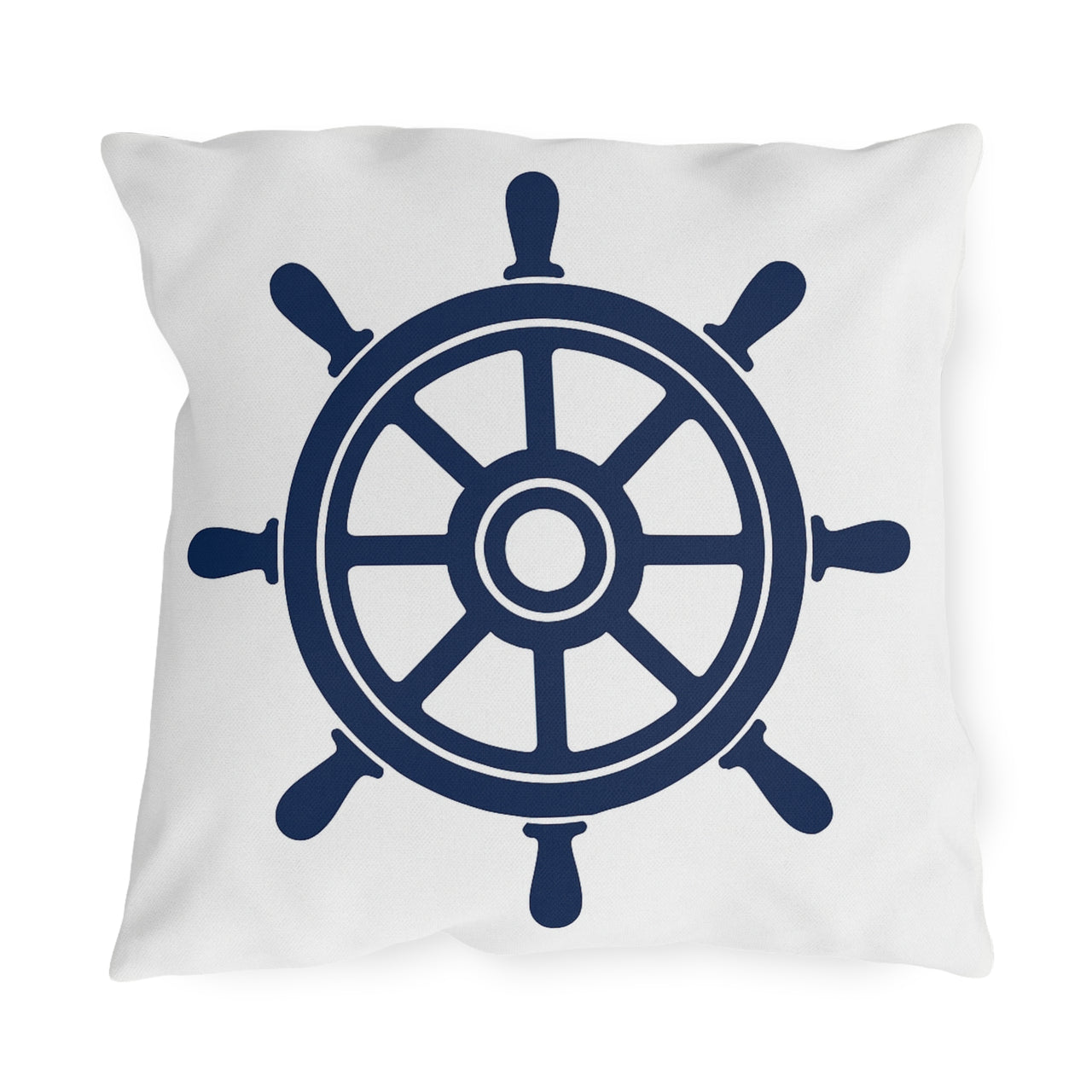 Pillow with a navy blue ship's wheel design on a white background