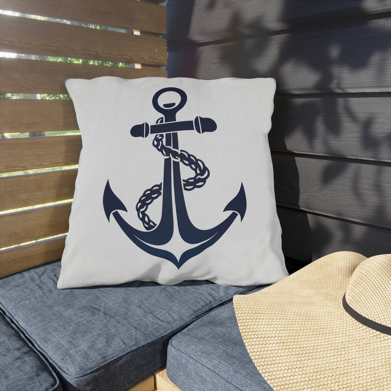 Pillow with anchor design on a wooden bench
