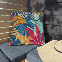 Thumbnail for Colorful leaf-patterned pillow on a bench with a straw hat nearby.