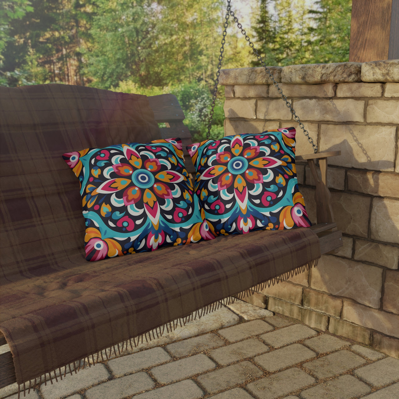 Wooden swing with colorful patterned cushions on a stone patio