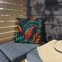 Thumbnail for Colorful leaf-patterned pillow on a gray cushion with a straw hat nearby.