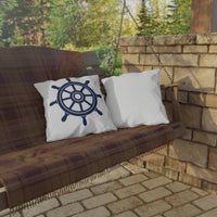 Thumbnail for Wooden swing with plaid blanket and pillows, one featuring a ship's wheel design, against a stone wall and greenery.