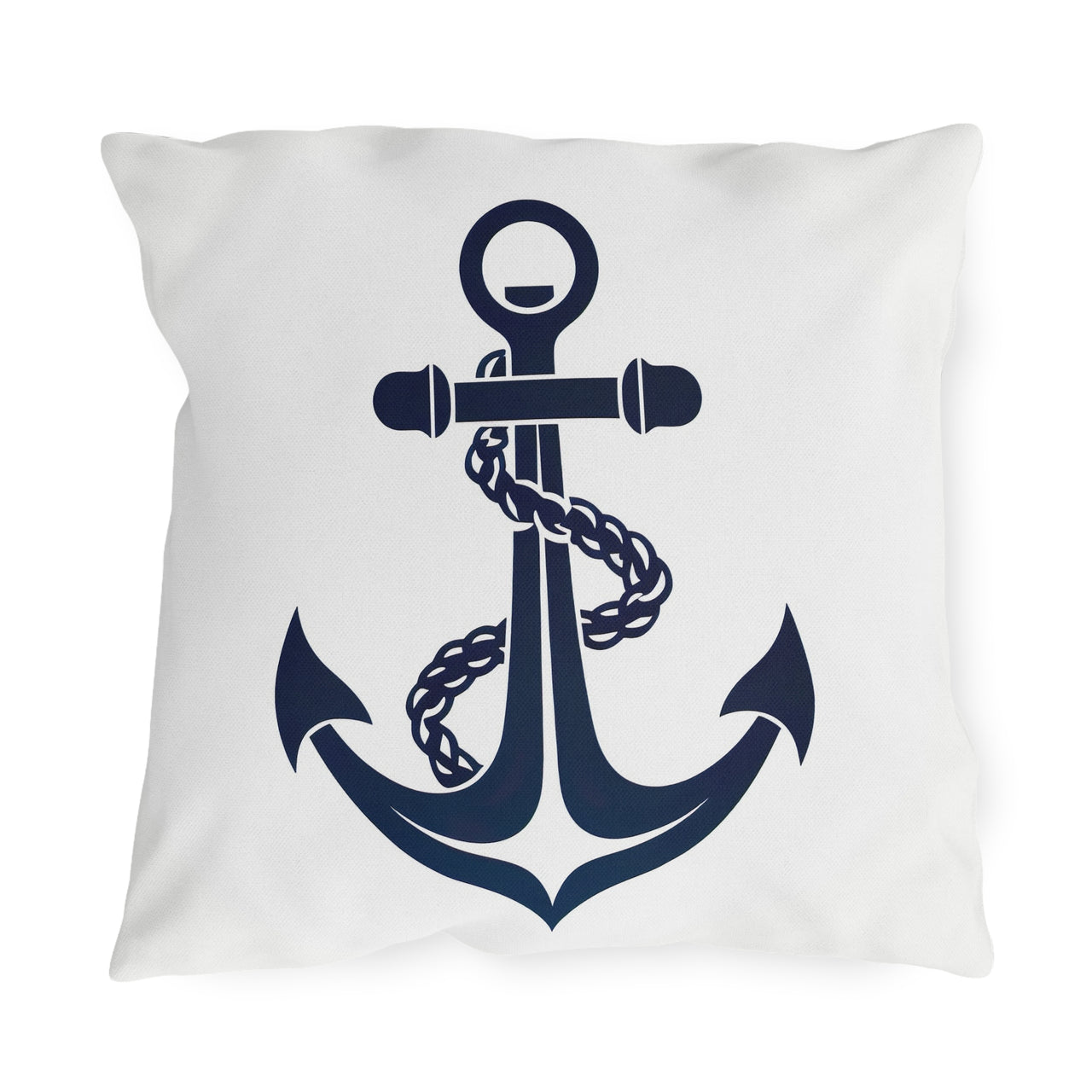 White pillow with a navy blue anchor design on a white background