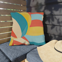 Thumbnail for Colorful striped pillow on a bench with a straw hat nearby