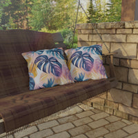 Thumbnail for Wooden swing with colorful leaf-patterned cushions on a stone patio.