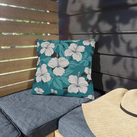Thumbnail for Floral-patterned pillow on a gray cushion with a straw hat nearby.